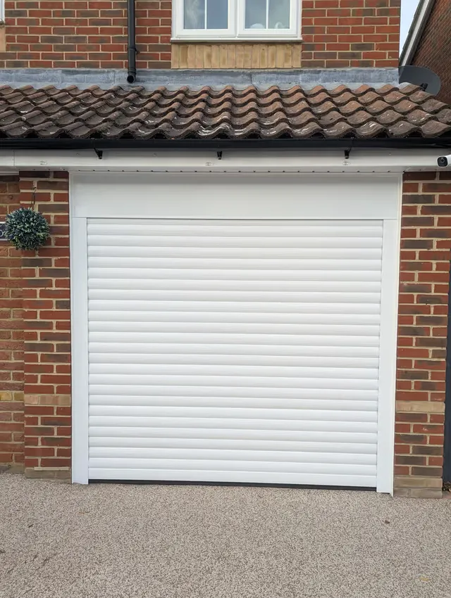 55mm white roller garage door fitted to a single garage in Essex