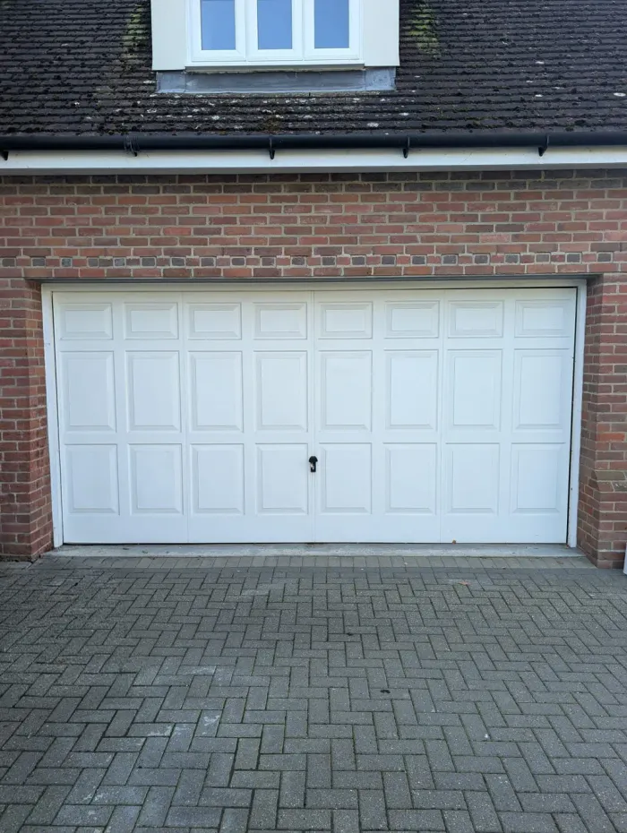 Worn roller garage door before Rollrite repair work