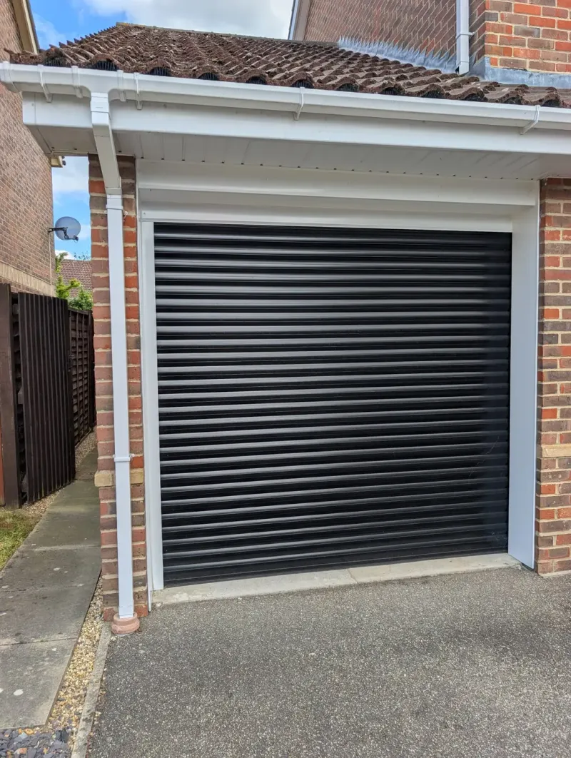 Rollrite team fitting a new roller garage door on site